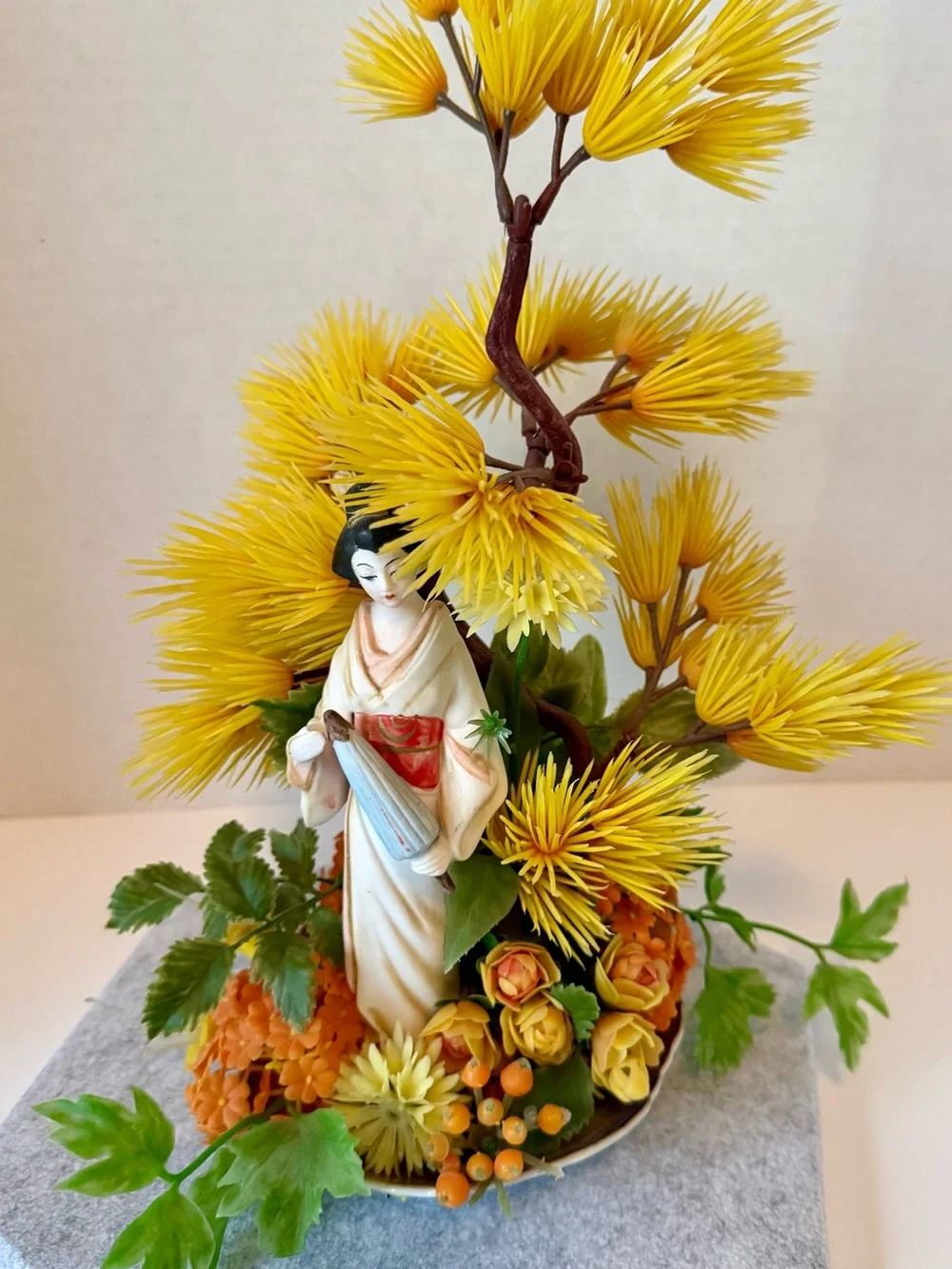 Vintage Japanese geisha figurine with artificial bonsai tree